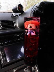 Chucky figure with red flowers and a black + red flake base Custom Shift
