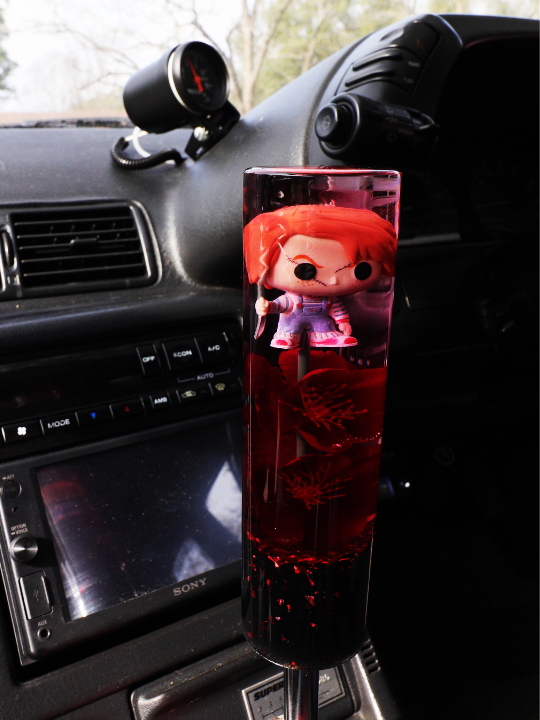 Chucky figure with red flowers and a black + red flake base Custom Shift