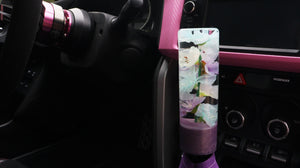 Cylinder shift knob with mulit-colored flowers and a lavender base